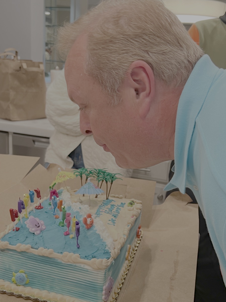 Raggs blowing out his 60th birthday candles